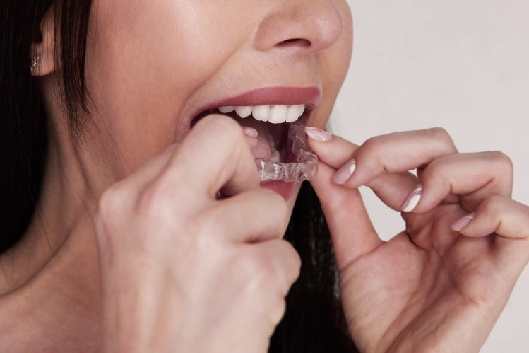 Girl holding night guard
